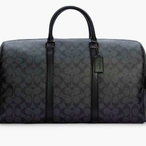 Coach Trekker 52 In Signature Canvas- Duffel
bag unisex